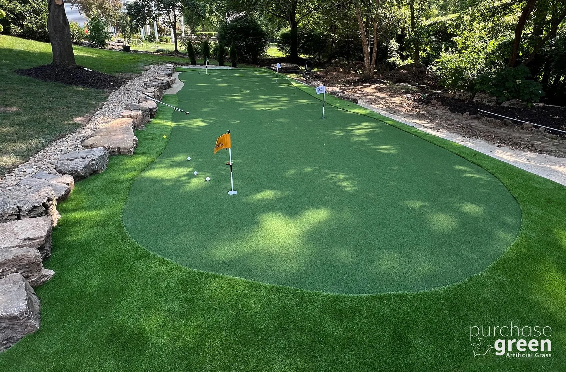 Ultra Play Olive artificial turf installed in a yard, manufacturer photo 1