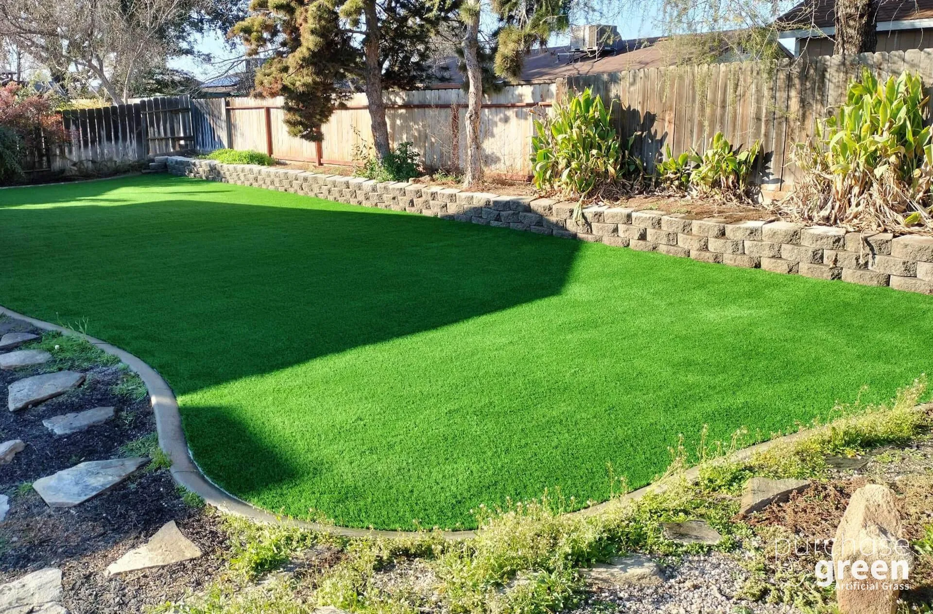 Bluegrass Light artificial turf installed in a yard, manufacturer photo 2